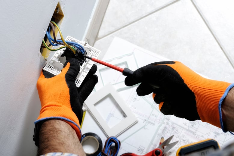 Electrician working in a residential electrical system